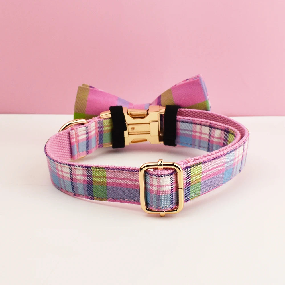 Plaid dog collar with a bow tie on a pink background