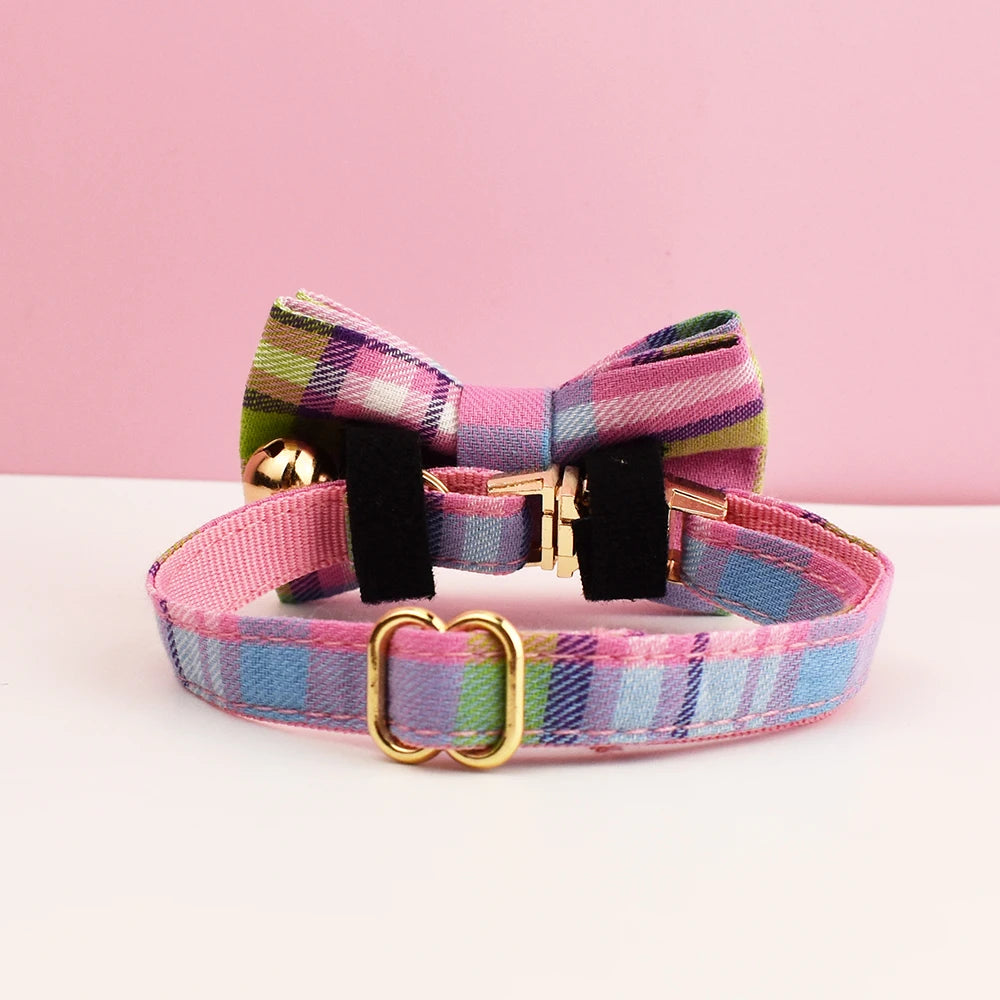 Plaid dog collar with a bow tie on a pink background