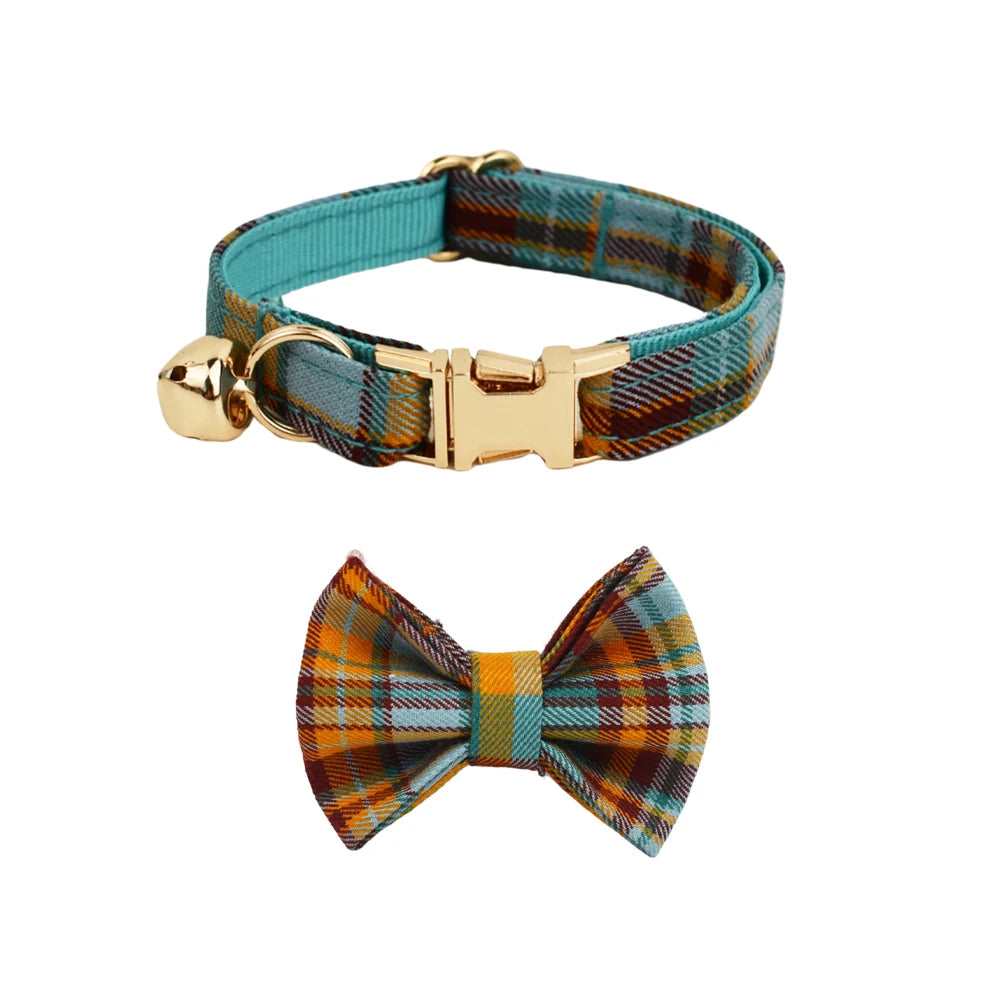 Plaid dog collar with gold buckle and matching bow tie on a white background